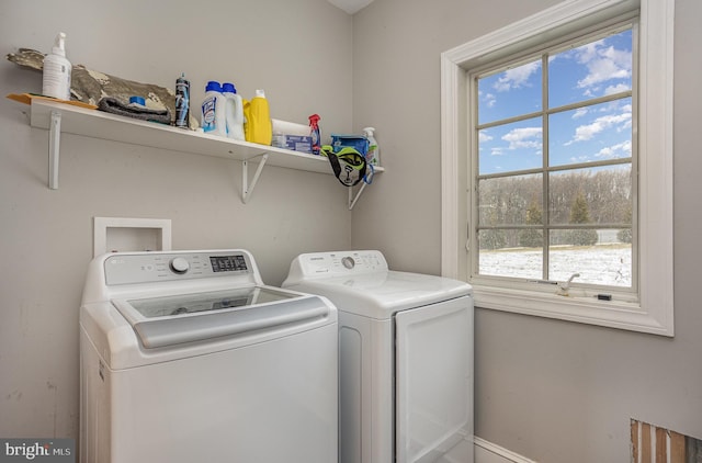 laundry room featuring washing machine and dryer