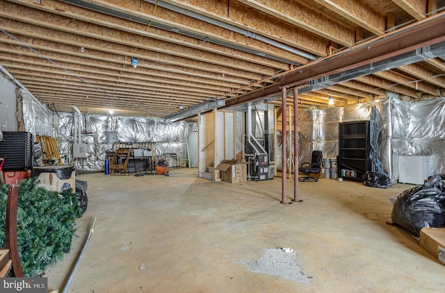 basement with heating unit and electric panel