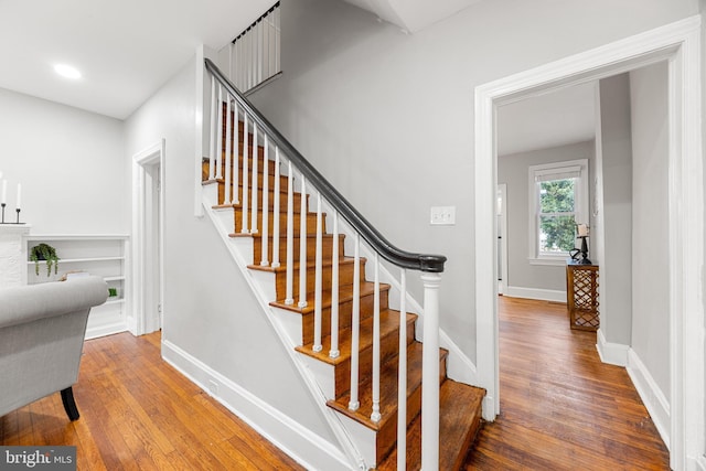 staircase featuring hardwood / wood-style flooring