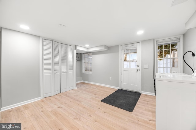 entryway featuring washer and dryer and light wood-type flooring