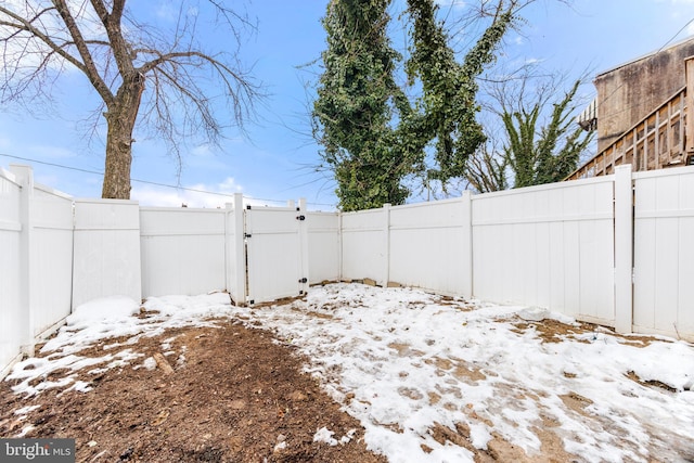 view of yard covered in snow