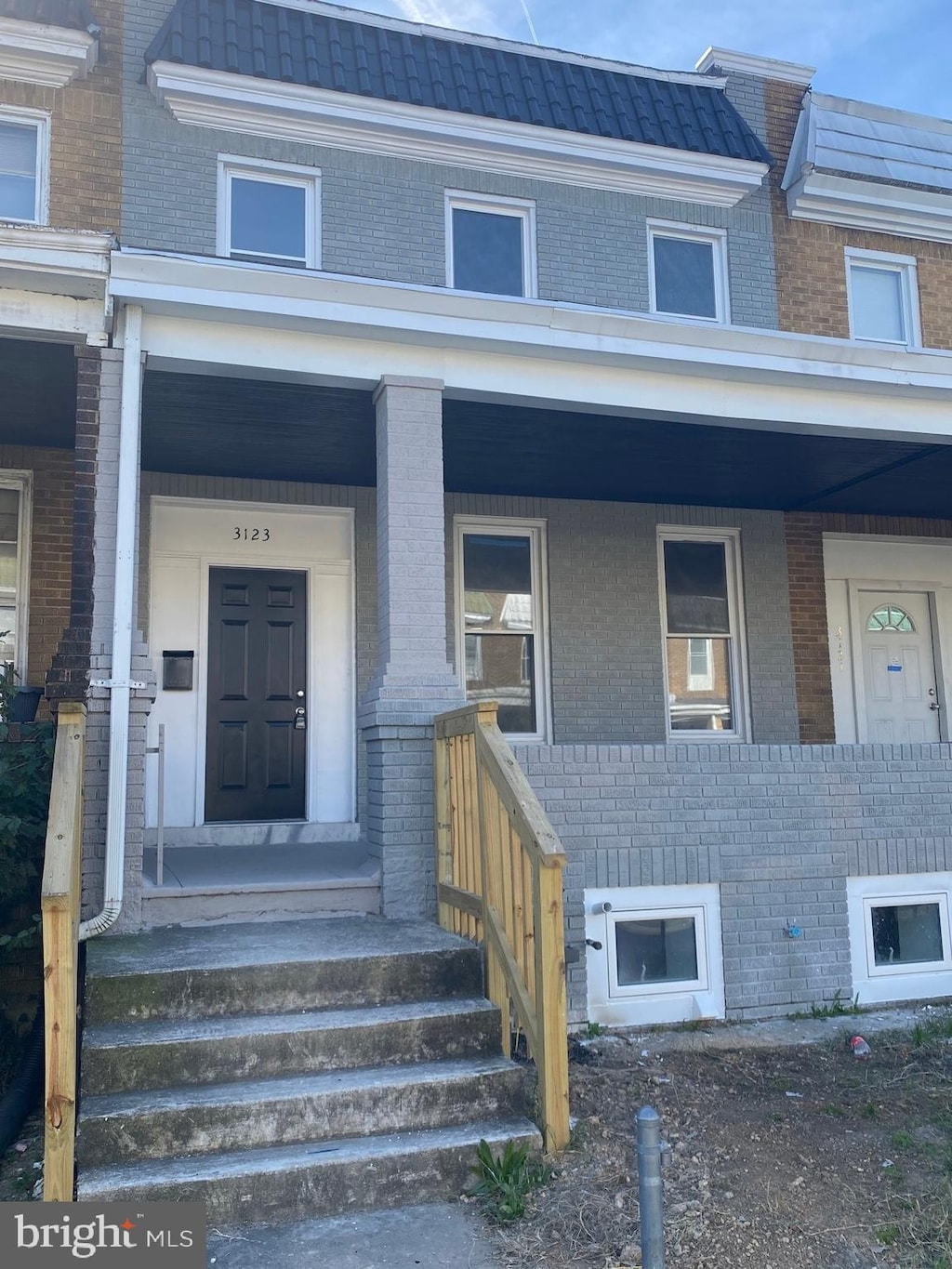 view of exterior entry featuring a porch