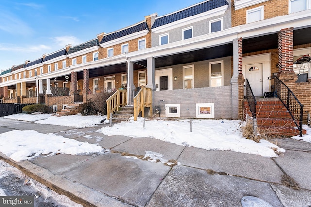 townhome / multi-family property with covered porch