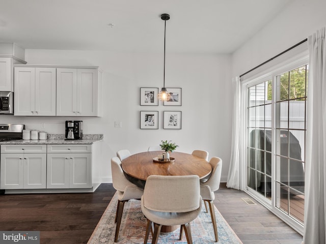 dining area featuring dark hardwood / wood-style flooring