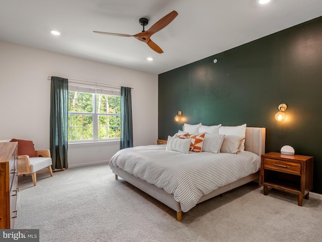 carpeted bedroom featuring ceiling fan