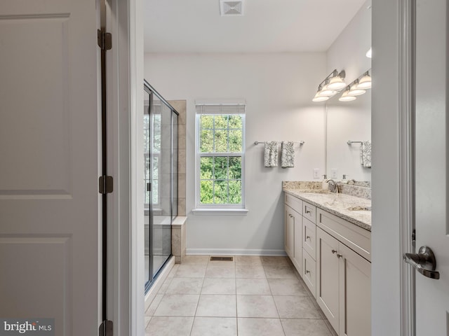 bathroom with vanity, tile patterned floors, and an enclosed shower