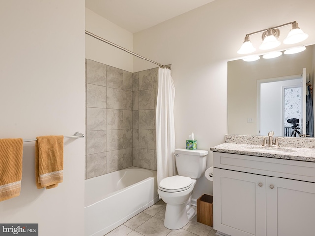 full bathroom featuring tile patterned floors, shower / bath combo, toilet, and vanity