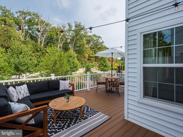 wooden deck featuring an outdoor living space