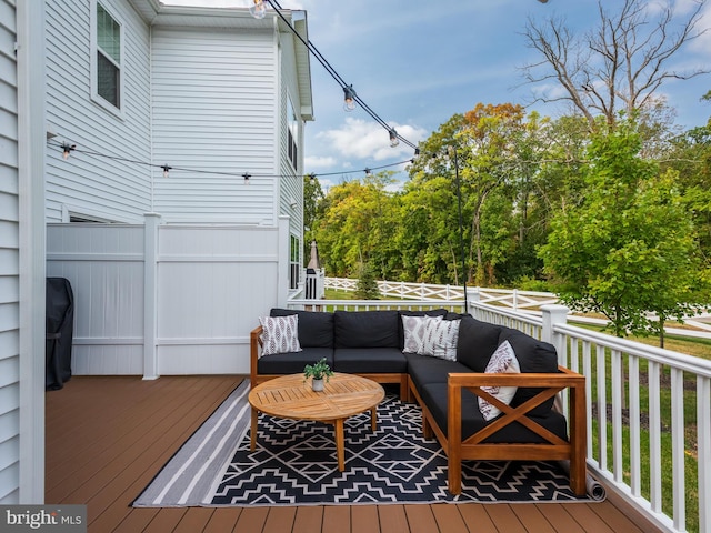 wooden deck with outdoor lounge area