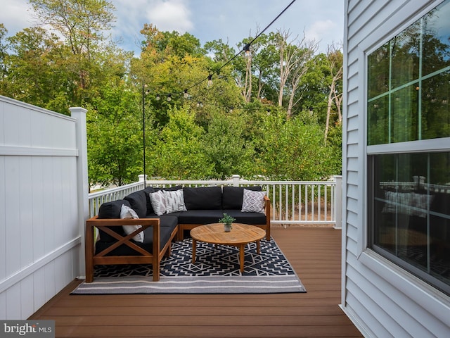 wooden deck featuring an outdoor living space