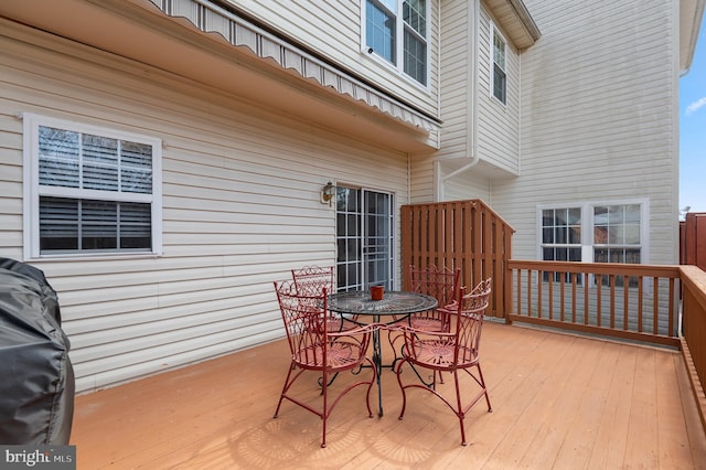 deck with outdoor dining area