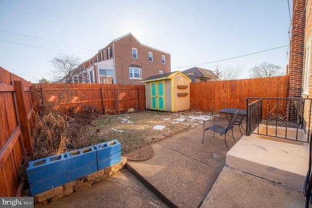 view of patio with a storage unit