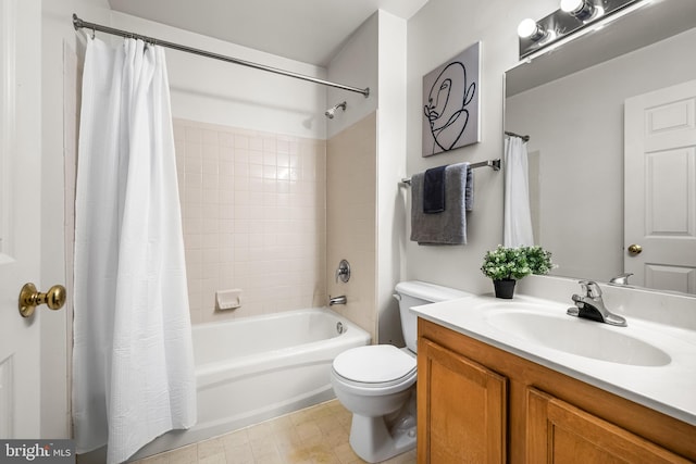 full bathroom featuring toilet, vanity, and shower / tub combo with curtain