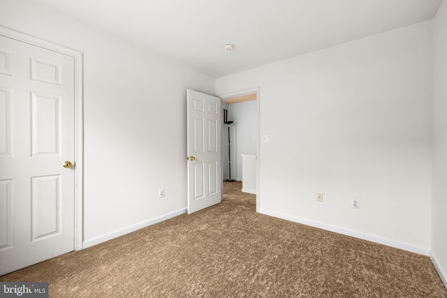 empty room featuring carpet flooring