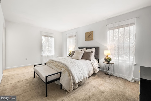 bedroom featuring light colored carpet