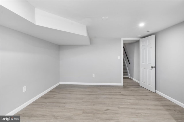 basement featuring light hardwood / wood-style floors