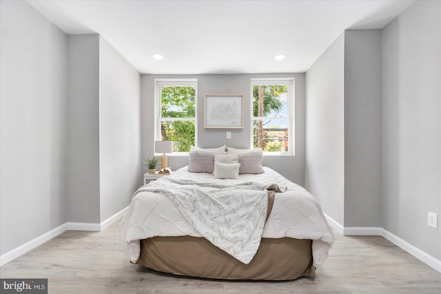 bedroom with light hardwood / wood-style floors