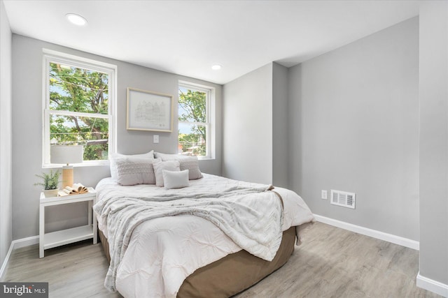 bedroom with light hardwood / wood-style floors