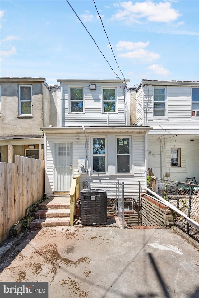 back of house featuring central AC and a patio