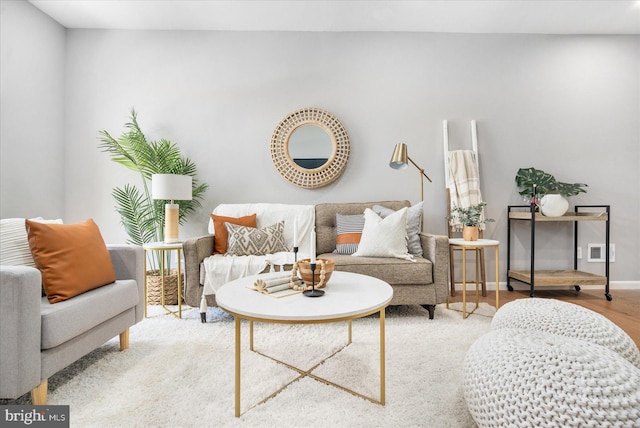 sitting room featuring hardwood / wood-style floors