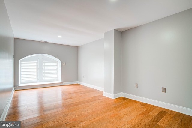 spare room featuring light hardwood / wood-style flooring