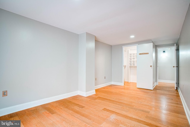 spare room featuring light hardwood / wood-style flooring