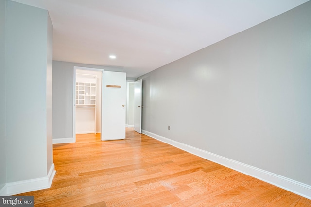 spare room with light hardwood / wood-style floors