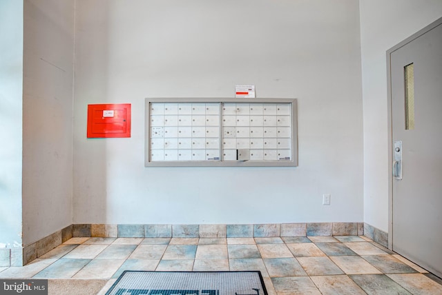 interior details with mail boxes and elevator