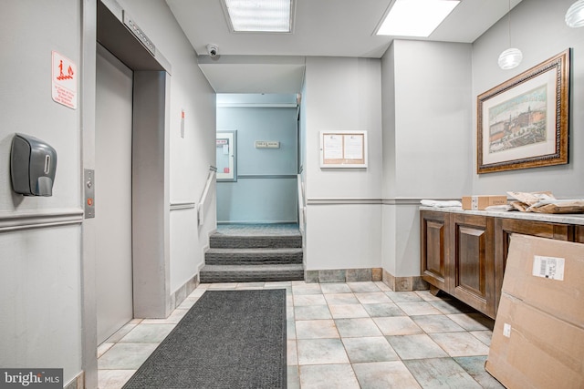 bathroom with vanity and elevator