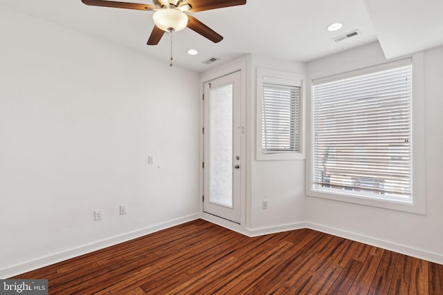 entrance foyer featuring ceiling fan, a healthy amount of sunlight, and hardwood / wood-style flooring