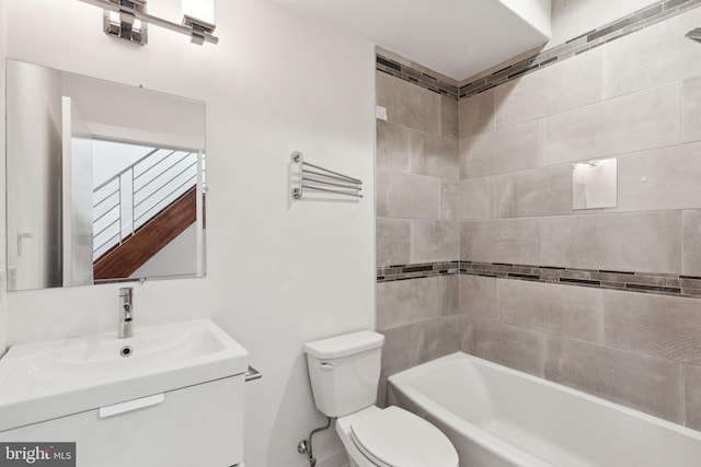 full bathroom with vanity, toilet, and tiled shower / bath combo