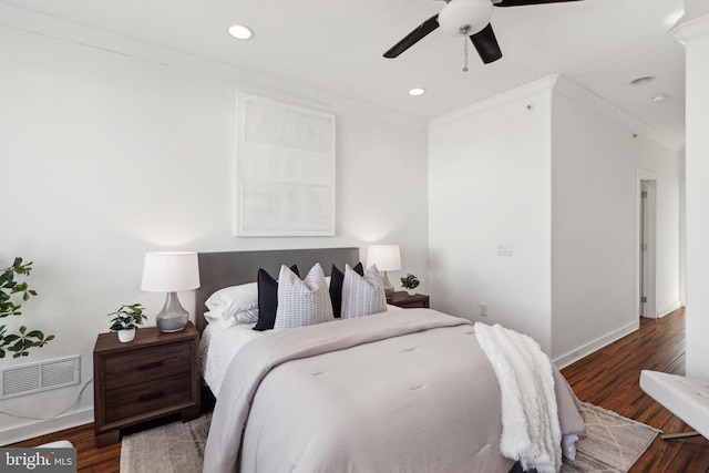 bedroom featuring ceiling fan, wood-type flooring, and ornamental molding