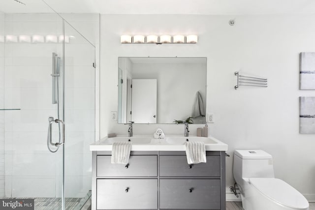 bathroom featuring vanity, toilet, and an enclosed shower