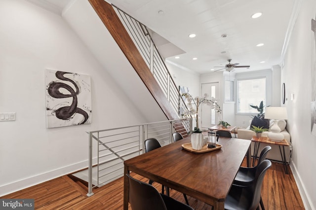 dining space with hardwood / wood-style flooring, ceiling fan, and ornamental molding