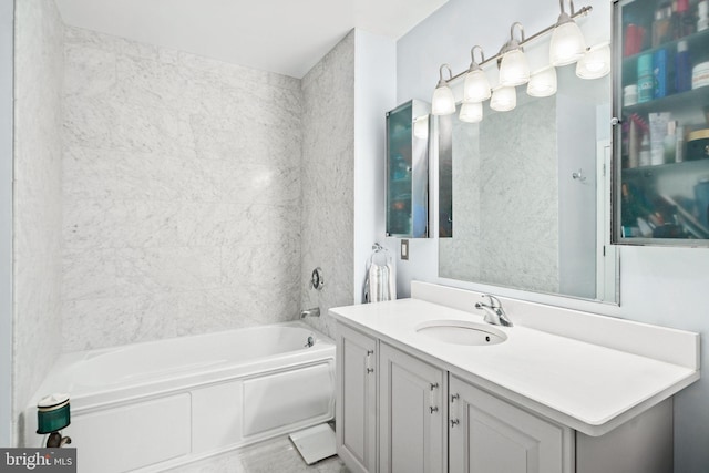 bathroom featuring vanity and a tub