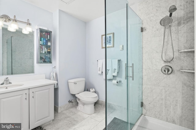 bathroom with vanity, toilet, and an enclosed shower