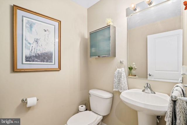 bathroom with toilet and sink