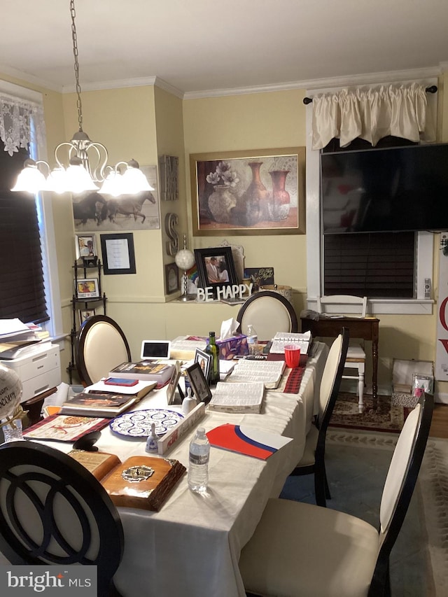 dining area with a notable chandelier and ornamental molding