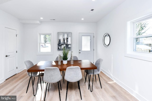 dining space featuring light hardwood / wood-style floors