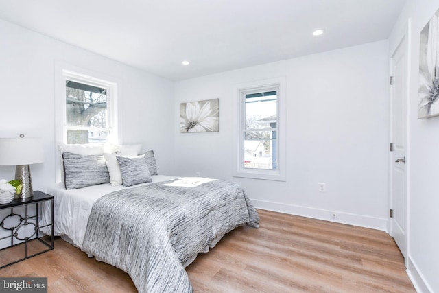 bedroom with hardwood / wood-style flooring