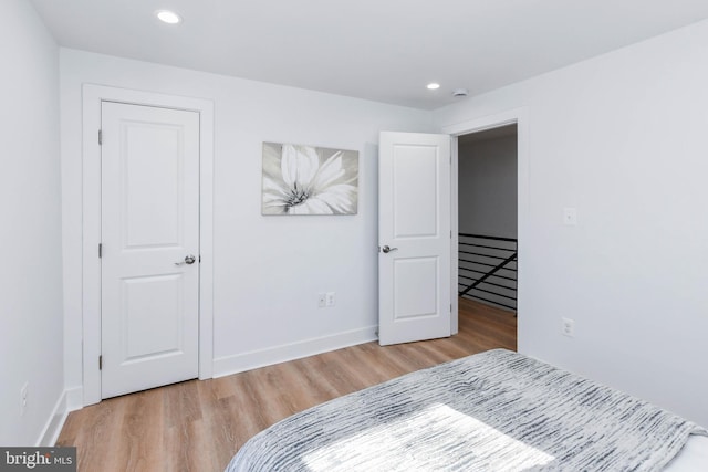 bedroom with light hardwood / wood-style flooring