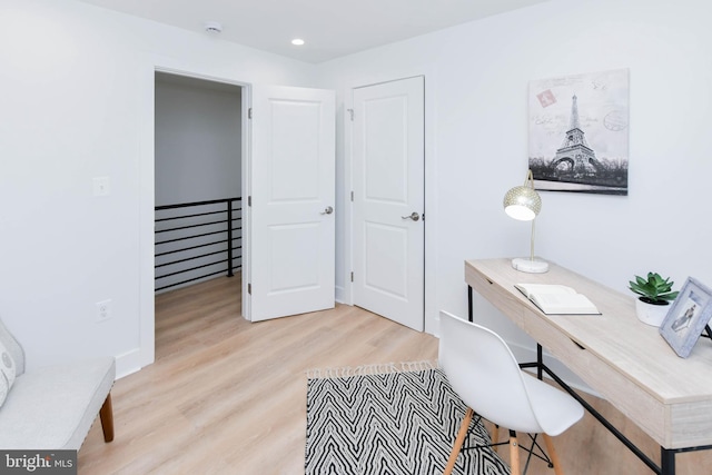 office with light hardwood / wood-style floors