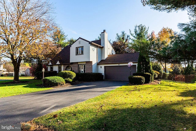 view of front property with a front yard and a garage