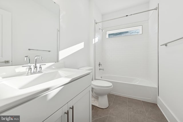 full bathroom featuring tile patterned floors, toilet, vanity, and tiled shower / bath