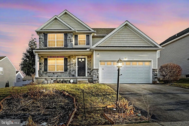 craftsman-style home with a porch and a garage