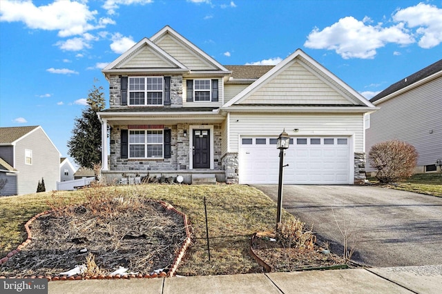 view of front of property with a garage and a porch