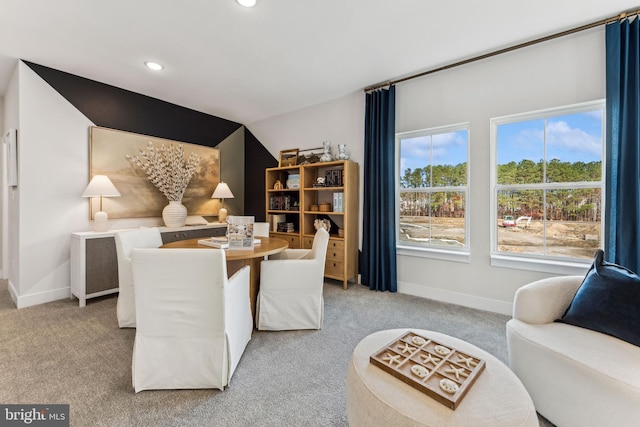 dining area featuring light colored carpet