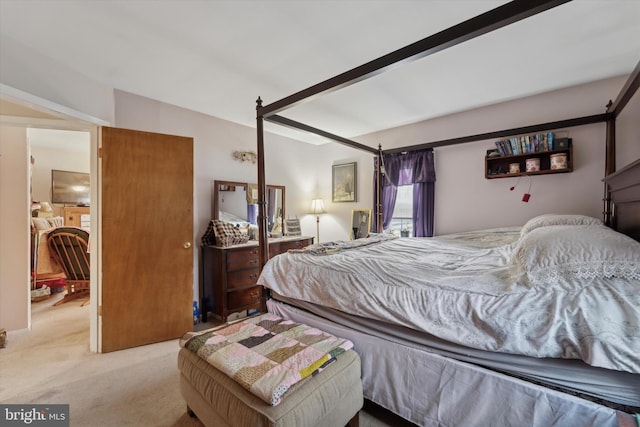 bedroom featuring light colored carpet