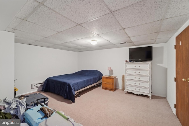 bedroom featuring baseboard heating and carpet floors