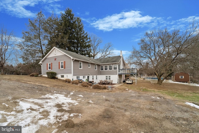 view of property exterior with a deck